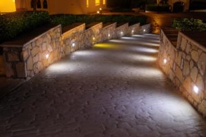 low voltage lighting illuminating walkway at night