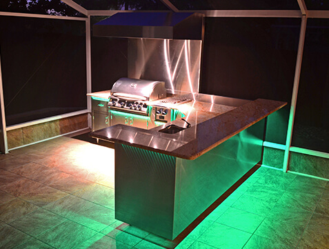 outdoor grill illuminated with green light