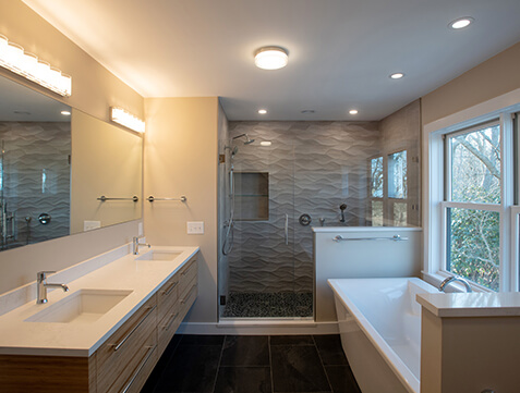 remodeled bathroom with custom lighting fixtures