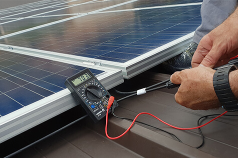 fronius electric testing solar panel installation with multimeter